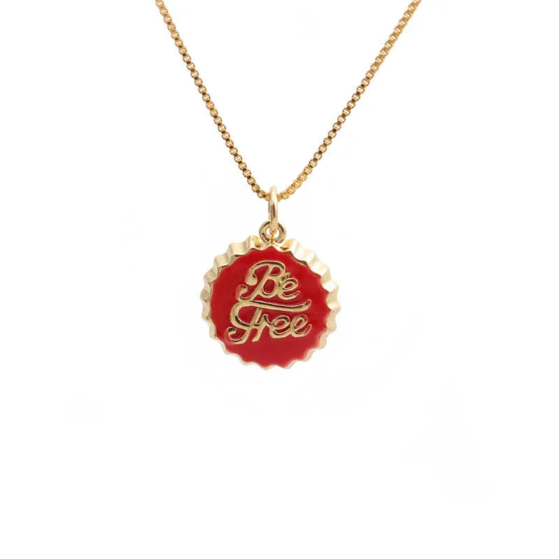 Copper bottle cap pendant necklace with gold plating on a box chain.