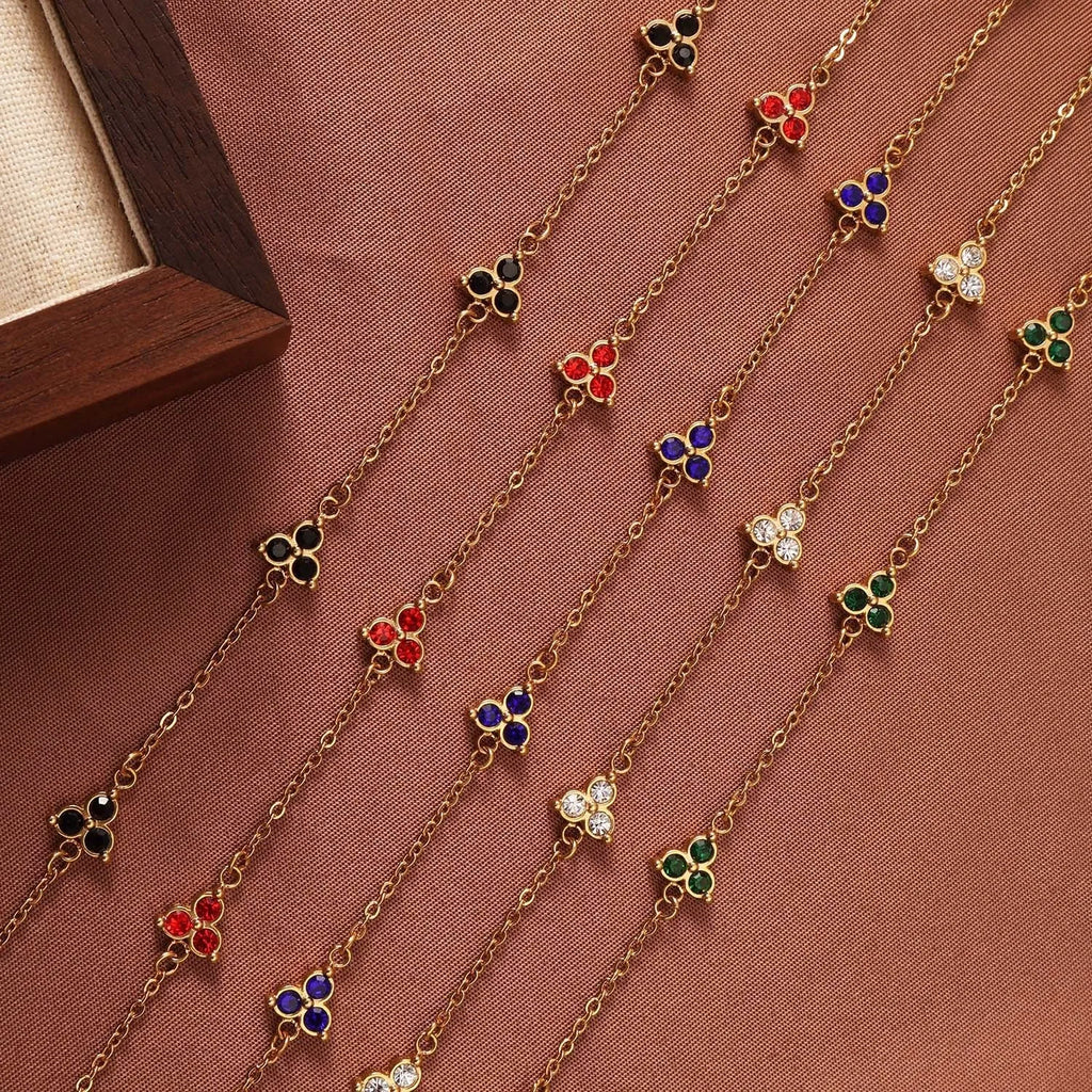 Geometric triangle women's bracelet in stainless steel with a choice of coloured centre stones on a gold or steel band.