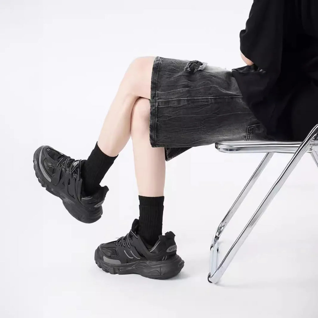 Washed denim shorts with ripped detailing in loose retro fit, black and blue colour options