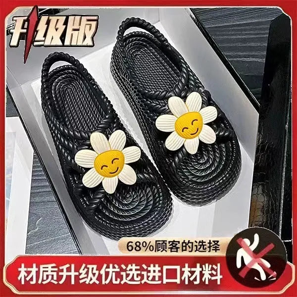 Beige women's flat sandals with a three-flower decoration and a non-slip PVC sole.