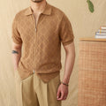 Light brown short sleeve zip-up cardigan with a lapel collar laid flat.