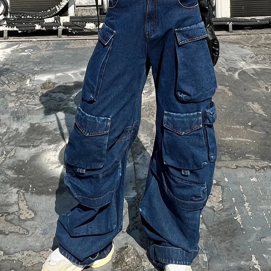 Dark blue distressed wide-leg jeans with a high waist and multiple pockets on a model.