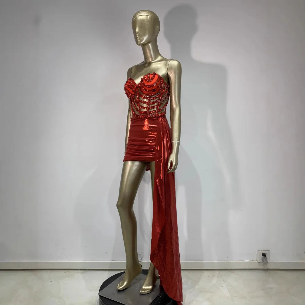 Red women's skirt suit with mesh see-through panels, a stage and party costume.