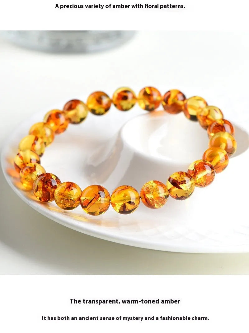 Natural yellow piebald amber bracelet with geometric polished beads showing flower spot patterning