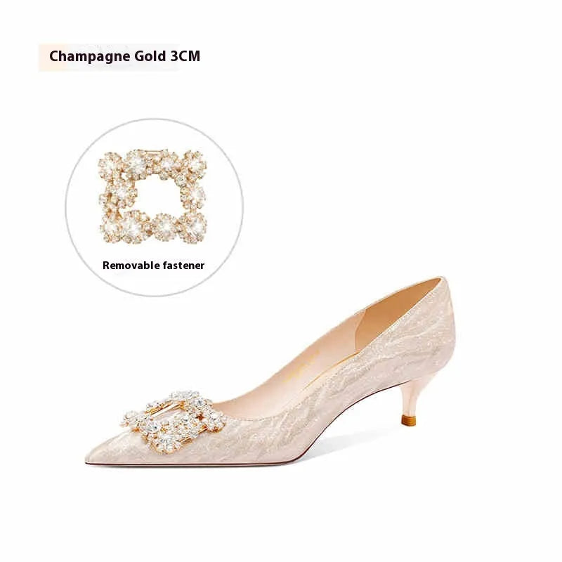 Champagne gold women's pointed-toe stiletto heels with rhinestone detail on the upper.