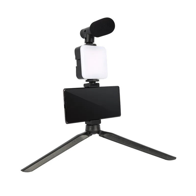 LED mini square universal camera flash on a pocket tripod, showing compact size and rotatable flash head.