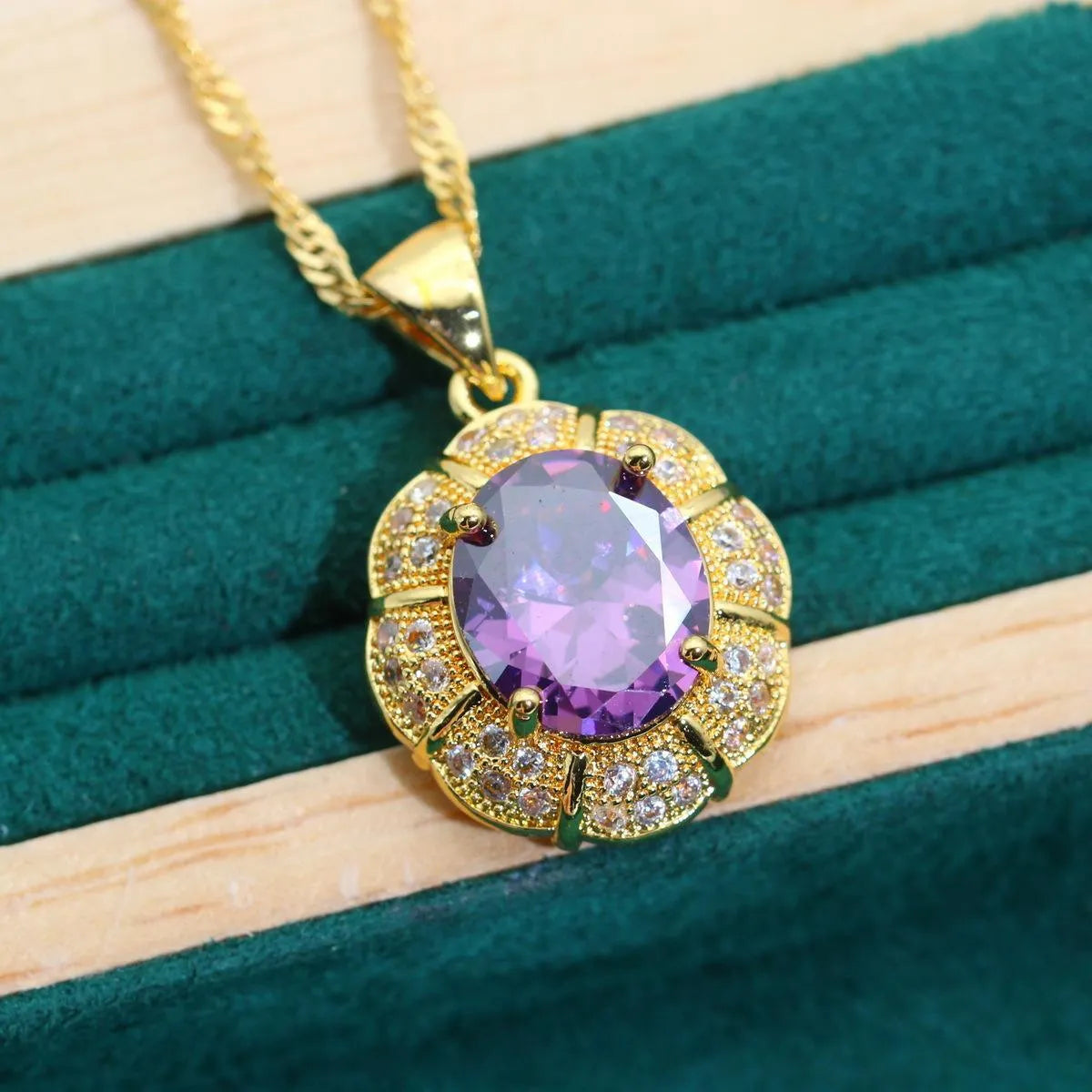 Gold plated cubic zirconia jewellery set showing necklace, earrings, ring, and bracelet with multi-colour stones