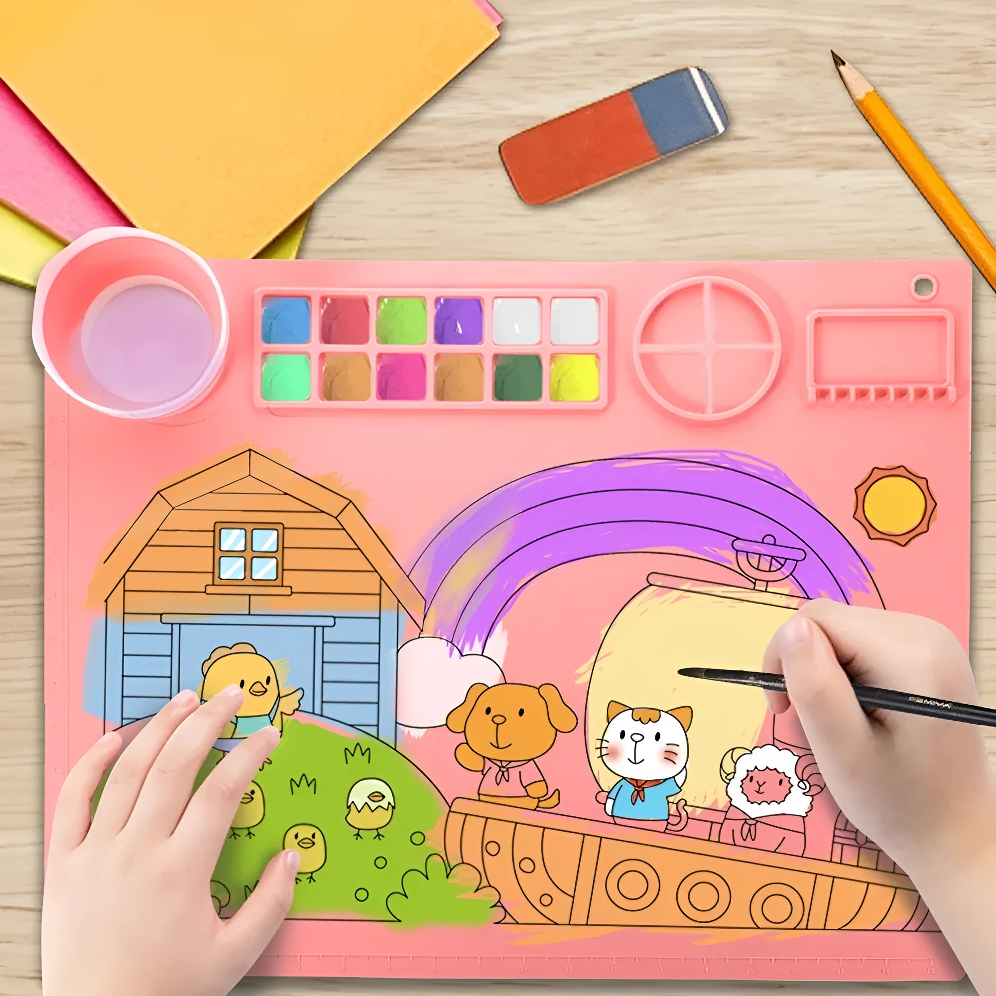 Light blue silicone painting mat with two round bowl compartments, measuring 50 by 40 cm.