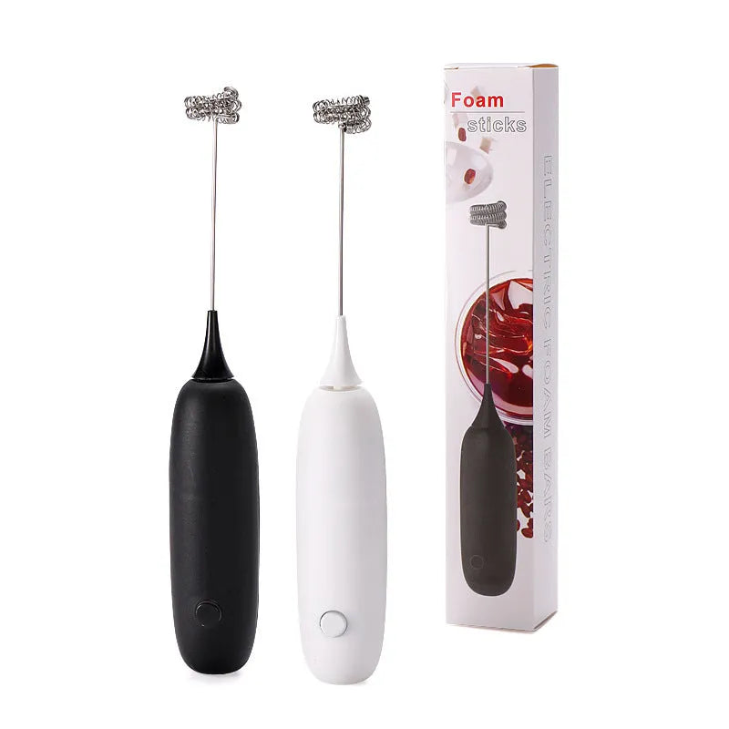 Black and white electric milk frother handheld blender for coffee drinks