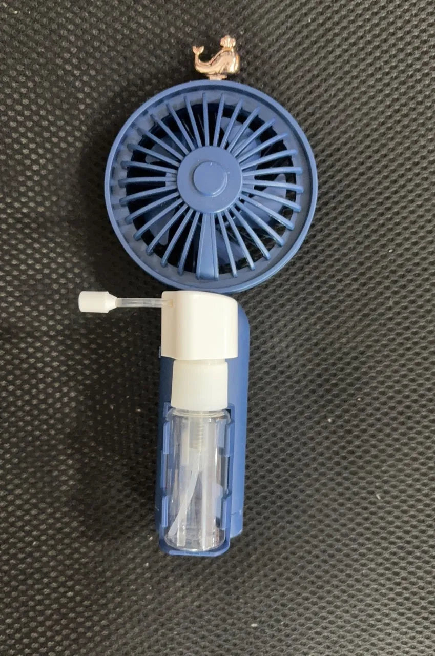 Personalised plastic handheld desk fan with USB port in apricot colour, showing scale.