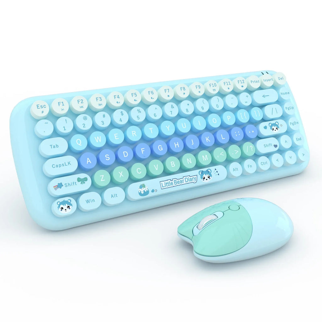 Candy pink wireless keyboard and mouse set on a desk next to a notebook computer.