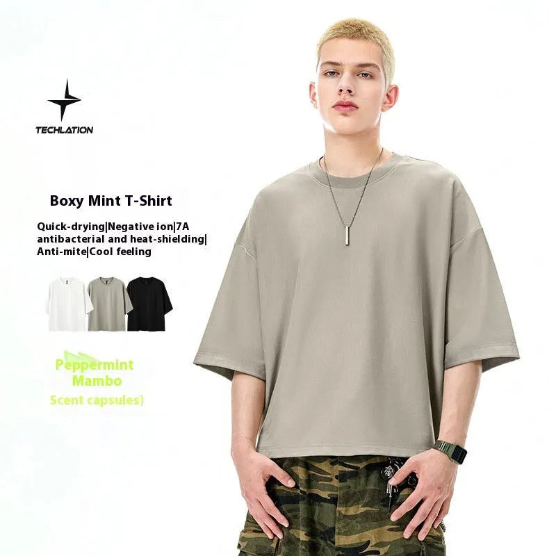 Men's sand grey loose fit short sleeve t-shirt showing regular sleeves and pullover style