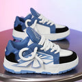 Men's white chunky sneakers with thick rubber sole and totem pattern detail on synthetic leather upper