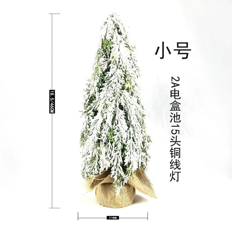 24-inch artificial Christmas tree with white snow finish and built-in LED lights on branches