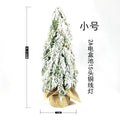 24-inch artificial Christmas tree with white snow finish and built-in LED lights on branches