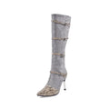 Grey and black women's knee-high boots with a thin 9cm high heel on a rubber sole.