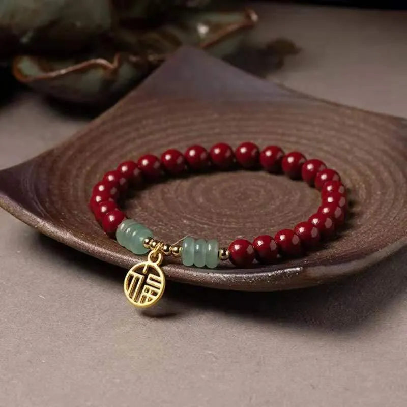 Gold cinnabar bracelet with wave design and copper beads in traditional Chinese style