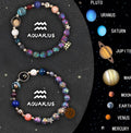 Two natural stone beaded bracelets with zodiac sign charms on a white background