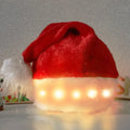 Red and white plush Santa hat with illuminated multi-colour LED lights around the base and a white pom-pom on top.