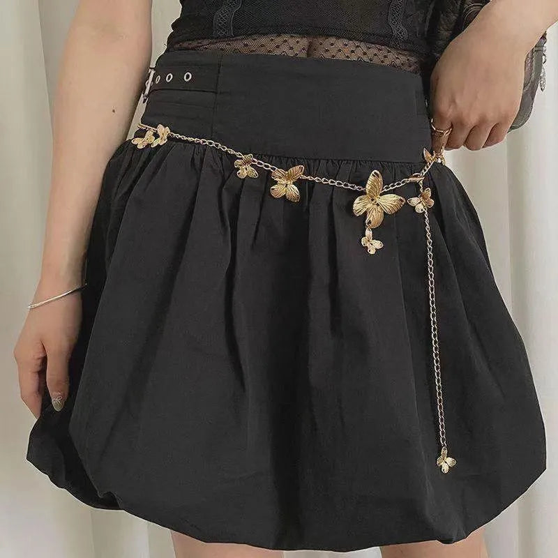 Women's gold butterfly waist chain alloy accessory with 104cm length on model