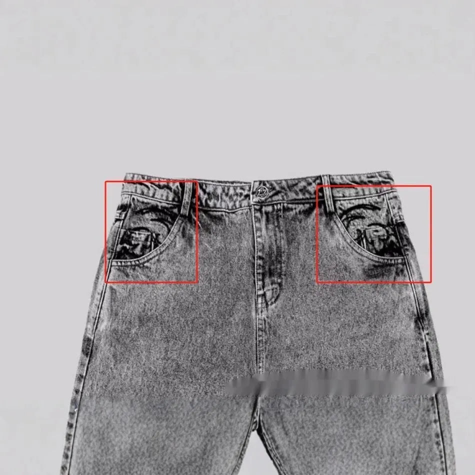 Grey loose-fit straight-leg denim trousers for men and women on a hanger.