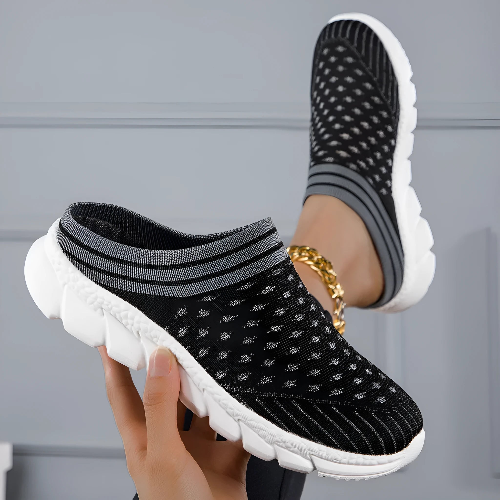 Women's striped Flyknit slipper shoes in black, pink, or purple with hollowed-out sewing line details