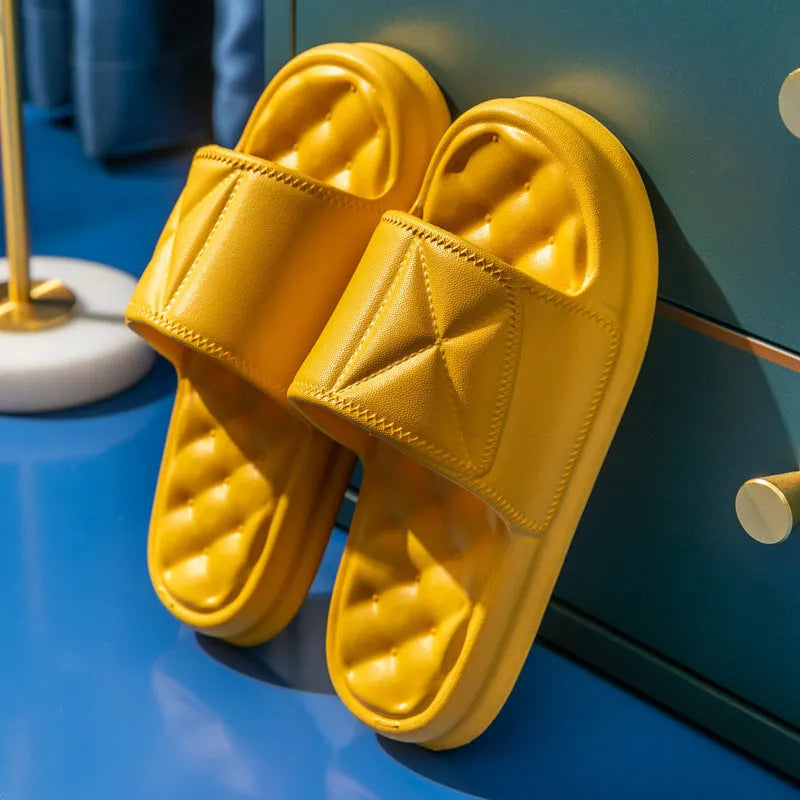 A pair of thick-soled EVA bathroom slippers in a selected colour, showing the non-slip sole pattern.