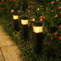 White cuboid solar-powered ground lamp for garden pathways with a solar panel on top.