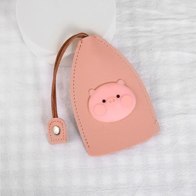 Cartoon design pull-out car key case made from soft PU leather, showing approximate size.