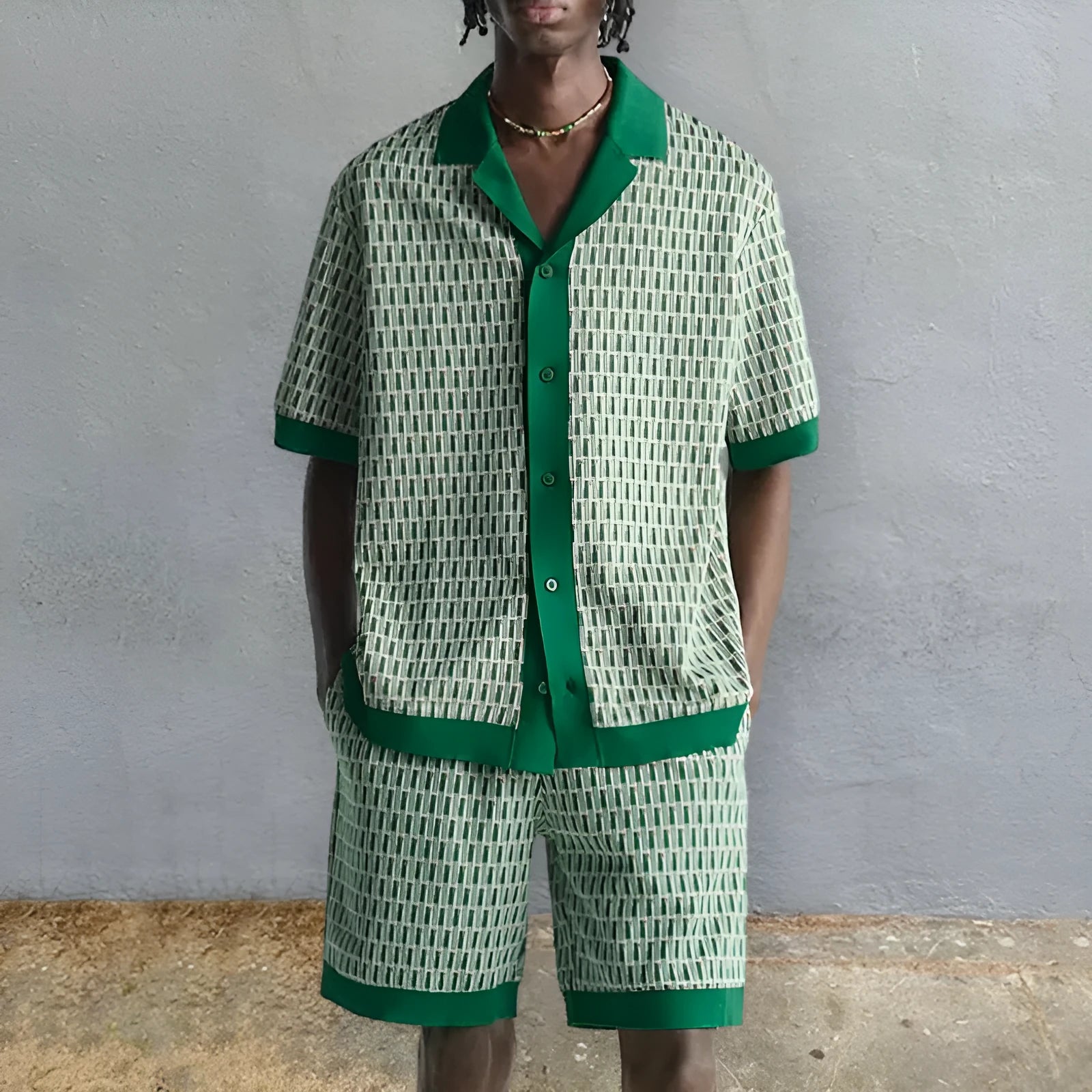 Men's printed short-sleeved shirt and matching elastic shorts two-piece set on a mannequin.