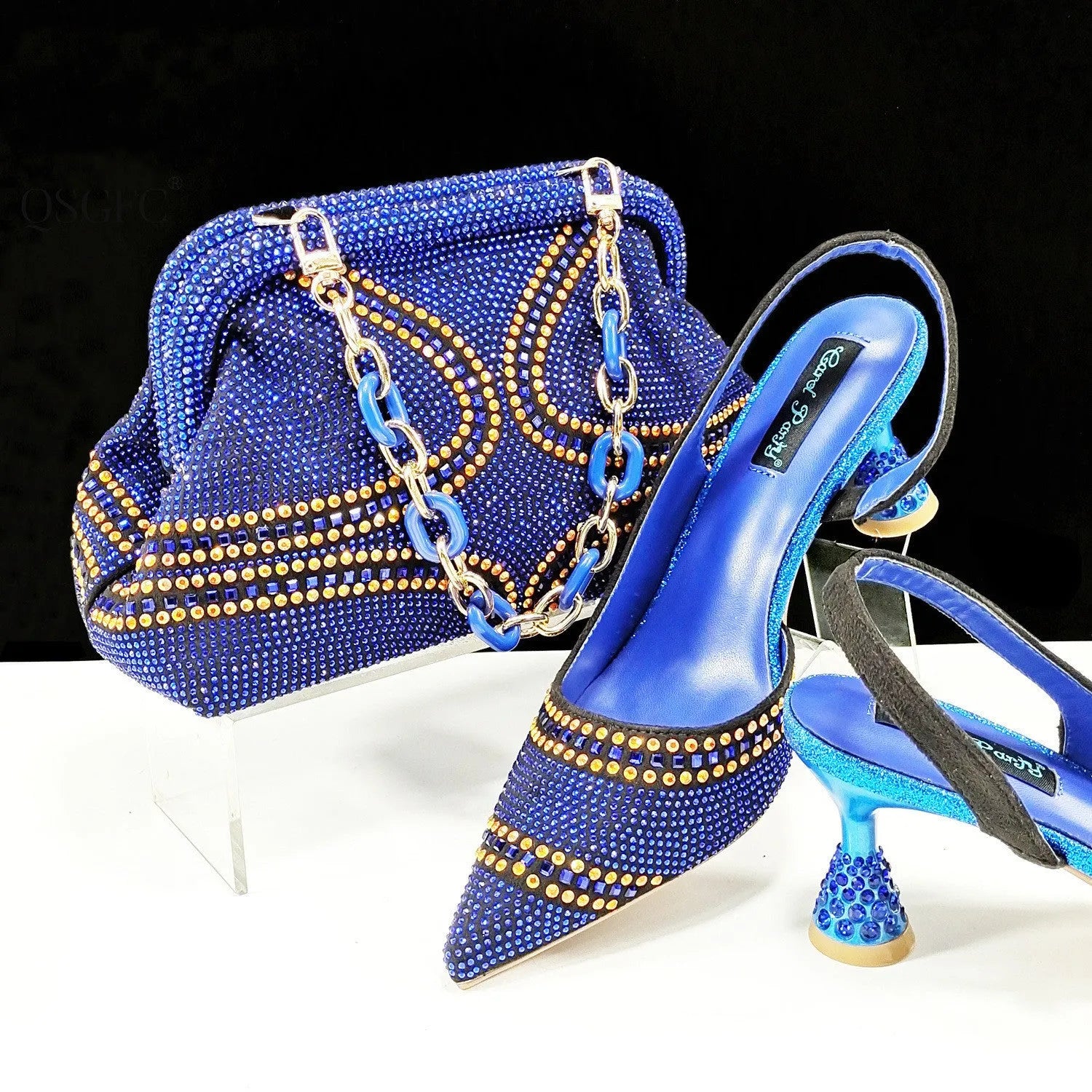Women's pointed toe high heels with matching small bag, shown in a selected colour with a wine glass heel and rhinestone detail.
