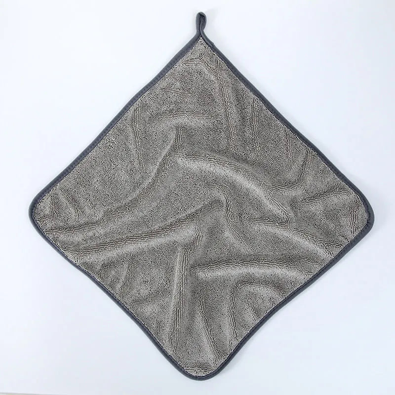 Grey car cleaning towel with red edge trim showing braided texture, laid flat to show dimensions