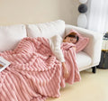 Solid colour double-sided thickened bubble velvet faux rabbit fur blanket shown in blue.