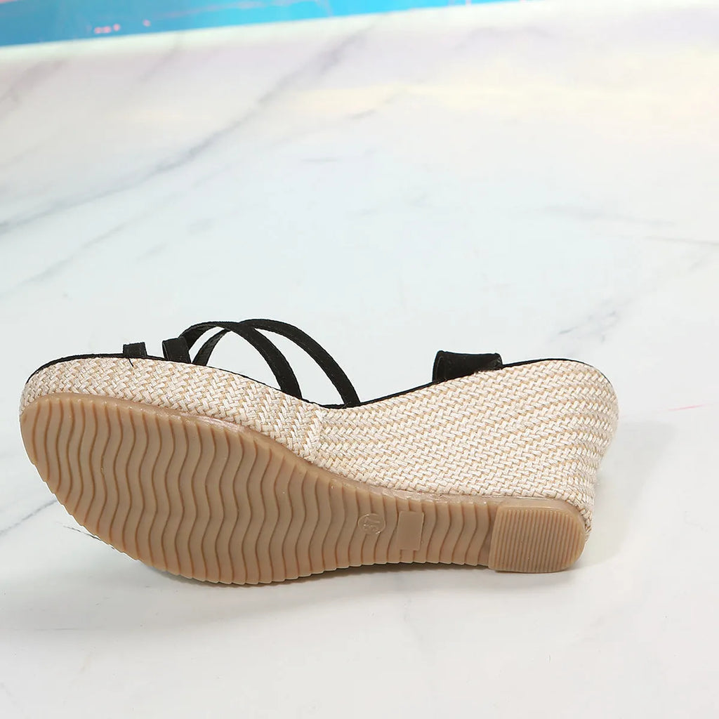 Women's wedge sandals with fish mouth toe design in black cloth material showing wedge heel