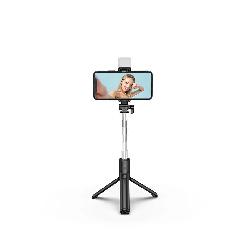 Black aluminium alloy Bluetooth selfie stick with extended tripod legs and phone holder attached.