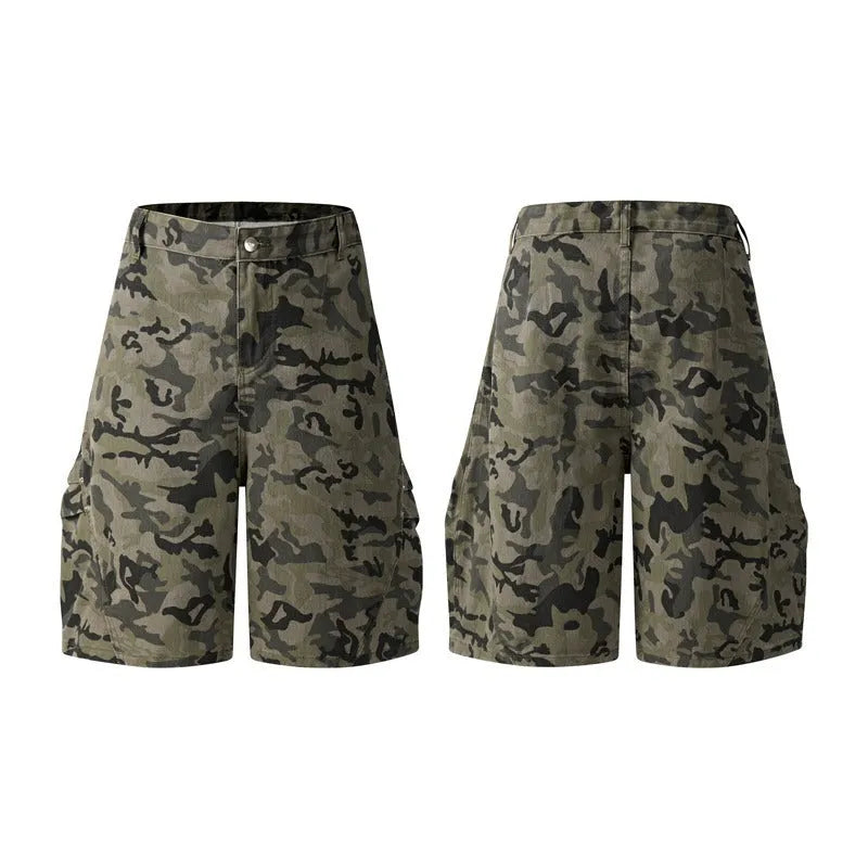 Man wearing grey retro loose-fit washed cotton workwear shorts with a half elastic waistband.