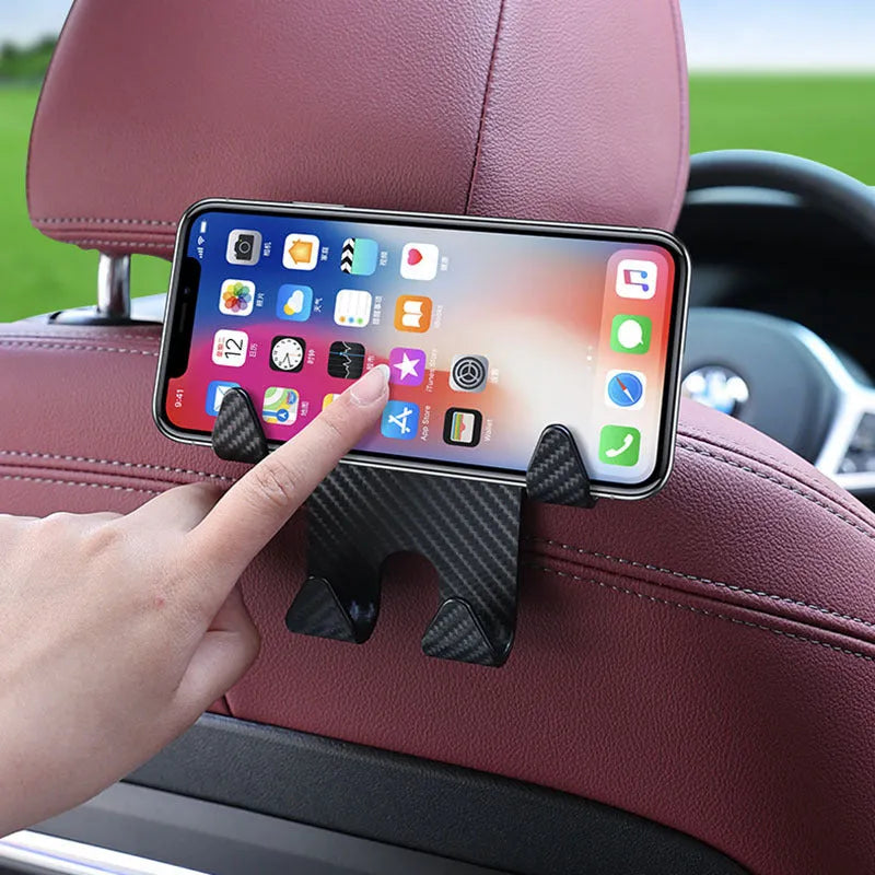 Black ABS plastic car multifunction hook bracket with integrated mobile phone holder for rear seat mounting.