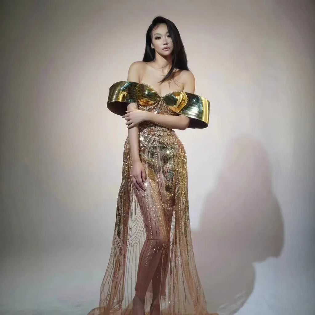 Gold strapless sequined evening dress with a high split tulle skirt.