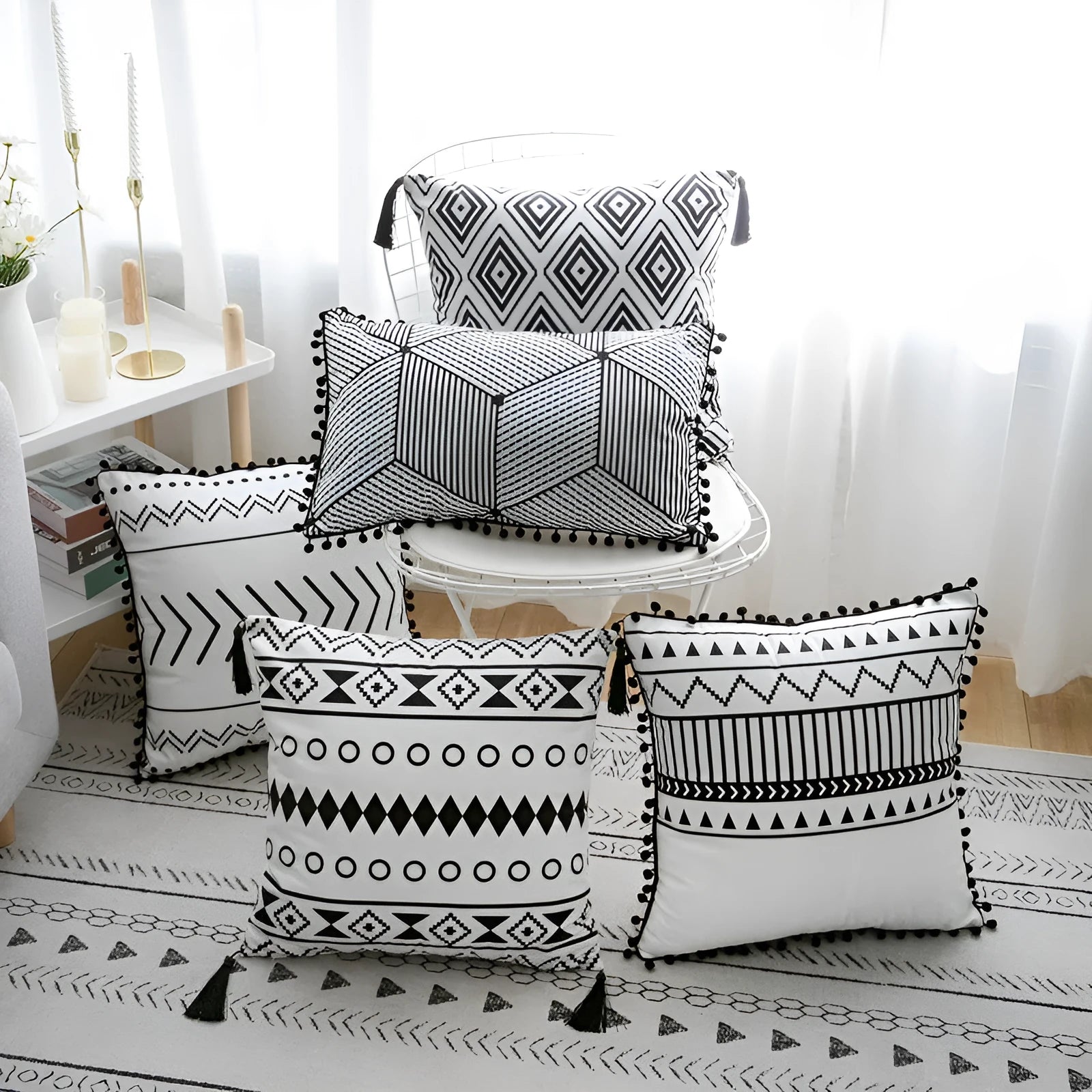 Bohemian patterned pillow cover in light gray on a living room sofa with decorative throw