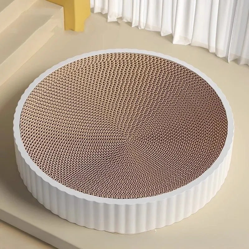 Green round cat scratching board with corrugated paper surface measuring 55 cm diameter