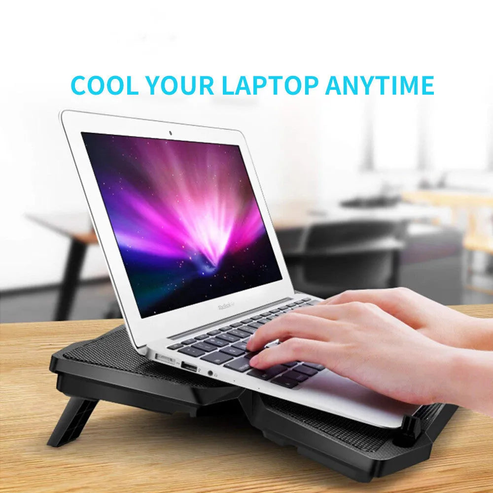 Blue PC cooling base with four LED fans, two USB ports and speed control switches for desktop computer ventilation