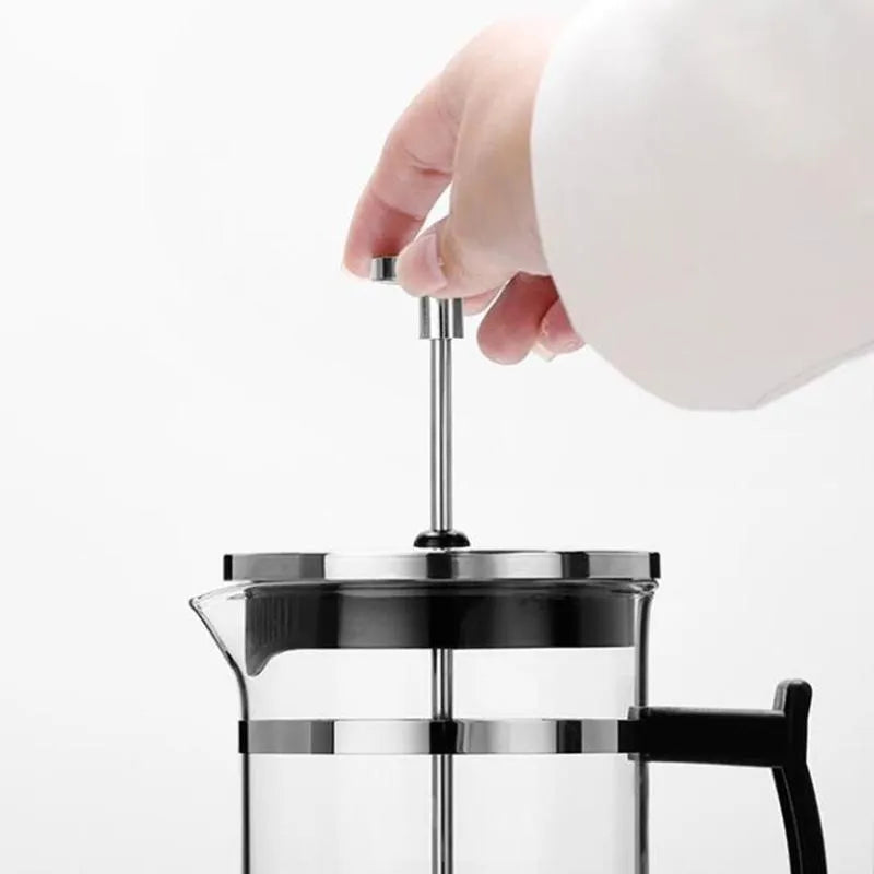 Compact glass and stainless steel cold brew coffee maker with 350ml capacity.