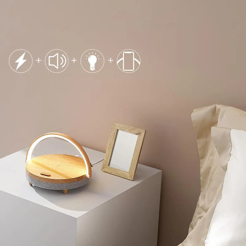 Marble pattern wireless charging LED night light with Bluetooth speaker and integrated mobile phone holder.