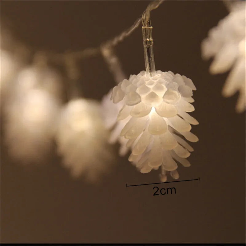 Battery-powered LED pine cone light string in warm white with plastic pine cone shells