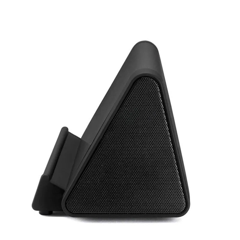 Black and white mini wireless Bluetooth speaker for mobile phones and computers.