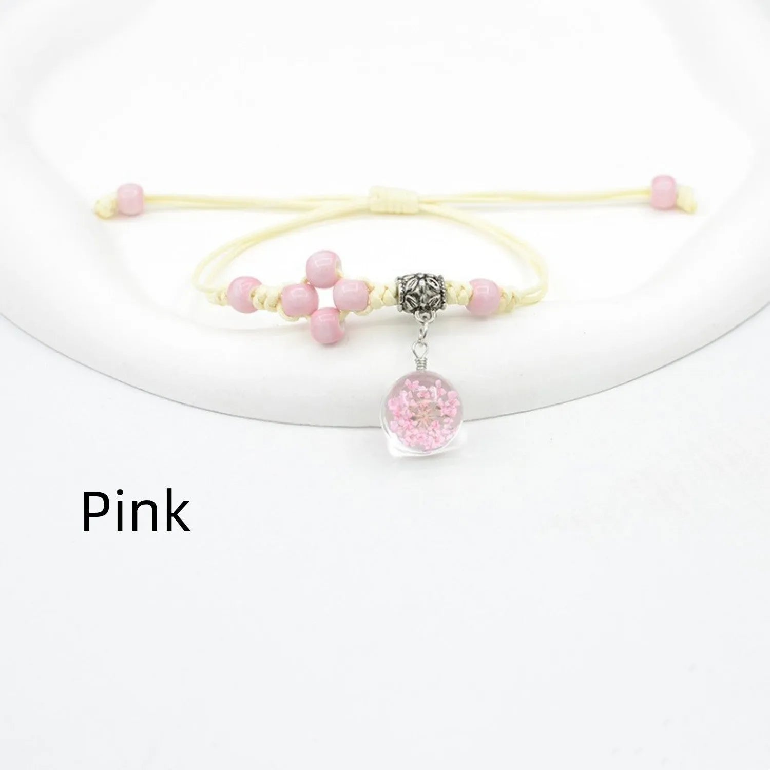 Glass dried flower bracelet with large 1.4 cm beads containing real preserved flowers in hand-woven lace design