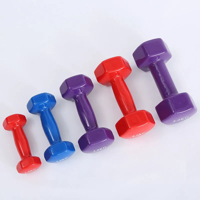 Bright coloured plastic fitness dumbbells with glossy finish in various weights for floor-safe exercise