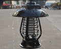 Black solar-powered mosquito lamp with solar panel and LED lights for outdoor insect control
