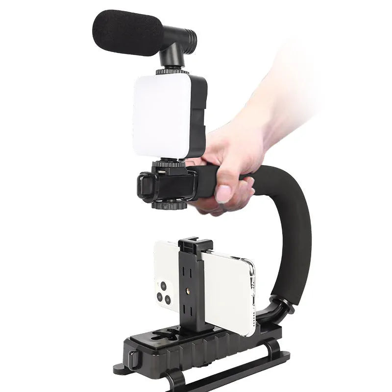 LED mini square universal camera flash on a pocket tripod, showing compact size and rotatable flash head.