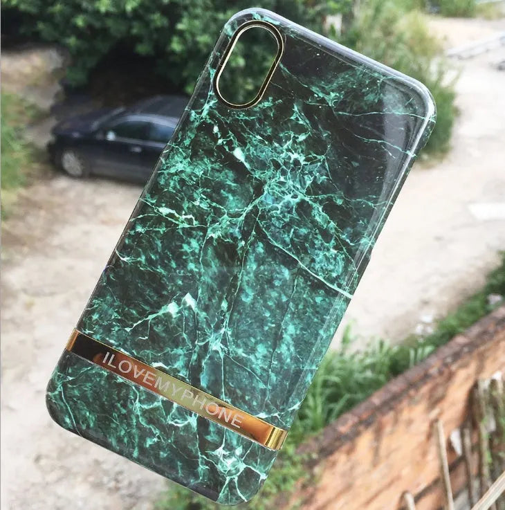 Marble pattern plastic case for iPhone on a table, shown in multiple colour options.